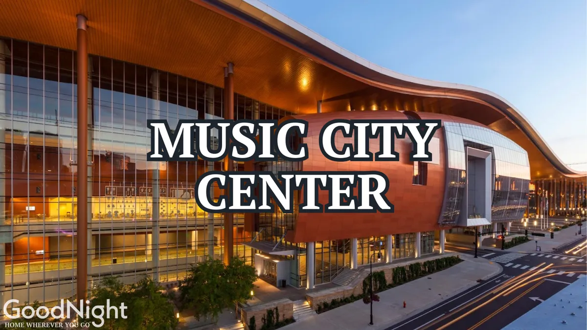 This exterior image showcases the distinctive Music City Center building, surrounded by the urban Nashville landscape and tree-lined streets. The modern architecture and proximity to city amenities are captured, emphasizing the venue's importance for conferences, conventions, and large-scale events.